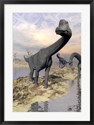 Framed Brachiosaurus dinosaurs near water with reflection by sunset and full moon Print