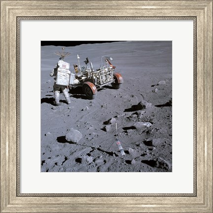 Framed Astronaut walking near the lunar rover on the moon, Apollo 16 Print