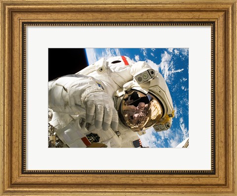 Framed Astronaut taking a spacewalk Print
