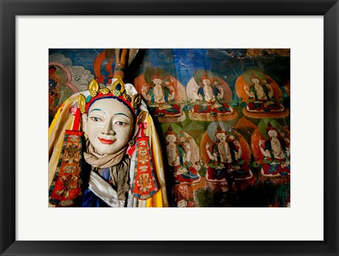 Framed Religious statue infront of Buddha mural at Shey Palace, Ladakh, India Print
