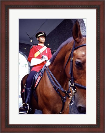 Framed Malaysia, Kuala Lumpur: a mounted guard stands in front of the Royal Palace Print