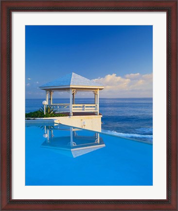Framed Gazebo reflecting on pool with sea in background, Long Island, Bahamas Print