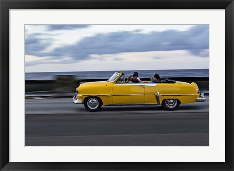Framed 1950&#39;s era car in motion along the Malecon or seawall, Havana, Cuba Print