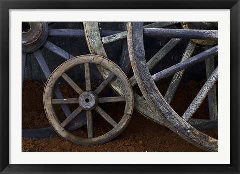 Framed Rustic wagon wheels on movie set, Cuba Print
