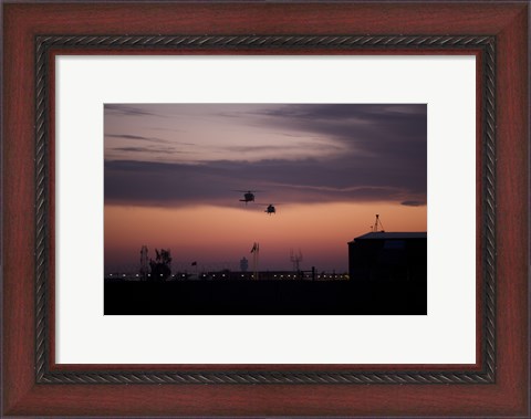 Framed pair of UH-60 Black Hawk helicopters approach their Landing in Baghdad, Iraq Print