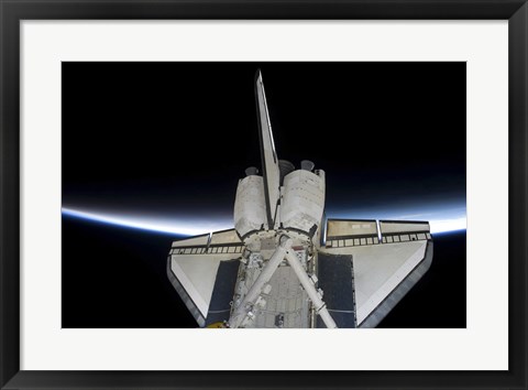 Framed Space Shuttle Discovery Intersecting the Thin line of Earth&#39;s Atmosphere, while Docked with the International Space Station Print