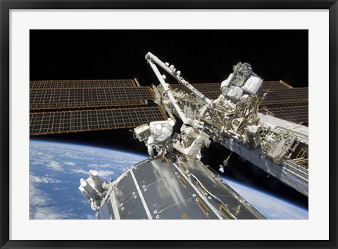 Framed Astronauts Perform a Series of Tasks on the Exterior of the International Space Station Print