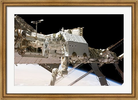 Framed Canadian-Built Dextre Robotic System in the Grasp of the Robotic Canadarm2 Print