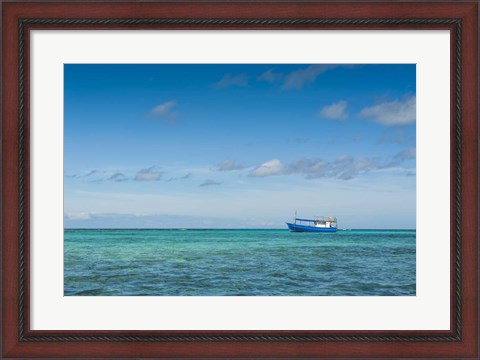 Framed Fishing boat in the turquoise waters of the blue lagoon, Yasawa, Fiji, South Pacific Print