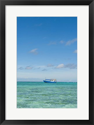 Framed Fishing boat in the turquoise waters of the blue lagoon, Fiji Print