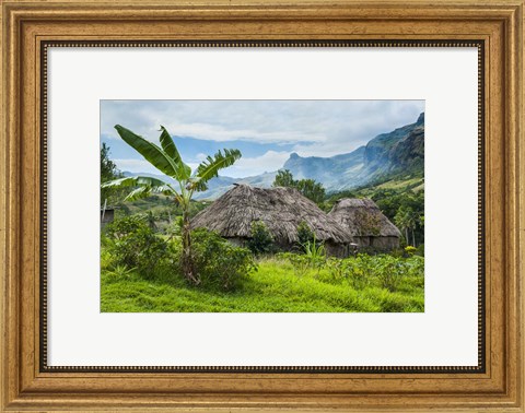Framed Traditional thatched roofed huts in Navala, Fiji Print