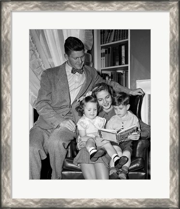 Framed 1940s Father Watching  Mother Reading To Son And Daughter Print