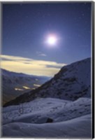 Framed Moon Above the Snow-Covered Alborz Mountain Range in Iran