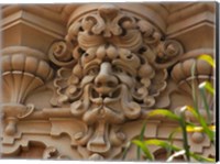 Framed Face In Stone On Buildings Wall