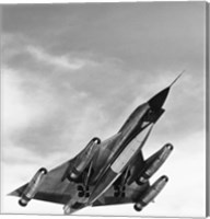 Framed Low angle view of a bomber plane in flight, B-58 hustler