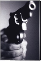 Framed Close-up of a person holding a handgun