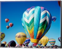 Framed Low angle view of hot air balloons taking off, Albuquerque International Balloon Fiesta, Albuquerque, New Mexico, USA