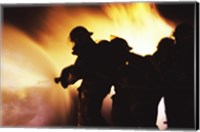 Framed Firefighters Extinguishing A Fire With Water