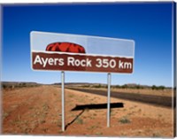 Framed Distance sign on the road side, Ayers Rock, Uluru-Kata Tjuta National Park, Australia