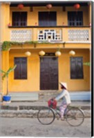 Framed Person riding a bicycle in front of a cafe, Hoi An, Vietnam