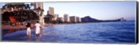 Framed Rear view of a couple wading on the beach, Waikiki Beach, Honolulu, Oahu, Hawaii, USA