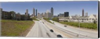 Framed Vehicles moving on the road leading towards the city, Atlanta, Georgia, USA