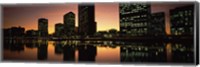 Framed Buildings lit up at dusk, Oakland, Alameda County, California, USA