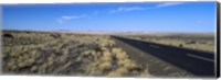 Framed Desert road passing through the grasslands, Namibia