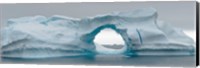 Framed Blue iceberg with hole, Antarctica