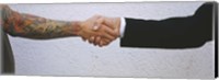 Framed Close-Up Of Two Men Shaking Hands, Germany