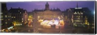 Framed High angle view of a town square lit up at dusk, Dam Square, Amsterdam, Netherlands