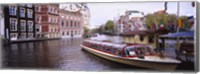 Framed Tourboat in a channel, Amsterdam, Netherlands