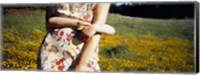 Framed Mid section view of a girl hugging her mother in a field, Marin County, California, USA