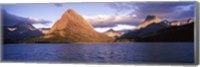 Framed Sunlight falling on mountains at the lakeside, Swiftcurrent Lake, Many Glacier, US Glacier National Park, Montana, USA