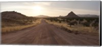 Framed Dirt road passing through a desert, Namibia