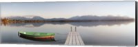 Framed Rowboat moored at a jetty on Lake Hopfensee, Ostallgau, Bavaria, Germany