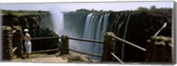 Framed Woman looking at the Victoria Falls from a viewing point, Zambia