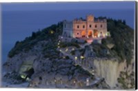 Framed High angle view of a church lit up at dusk on a cliff, Santa Maria dell Isola, Tropea, Calabria, Italy