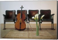 Framed Cello leaning on attached chairs