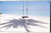 Framed Beach swing and shadow of palm tree on sand