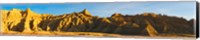 Framed Rock formations on a landscape in golden light, Saddle Pass Trail, Badlands National Park, South Dakota, USA