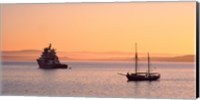Framed Tugboat and a tall ship in the Baie de Douarnenez at sunrise, Finistere, Brittany, France