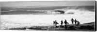 Framed Silhouette of surfers standing on the beach, Australia (black and white)