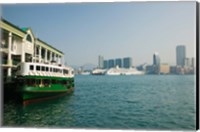 Framed Star ferry on a pier with buildings in the background, Central District, Hong Kong Island, Hong Kong