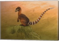 Framed Sinosauropteryx dinosaur resting on a log