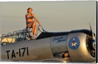 Framed 1940's style pin-up girl sitting on the cockpit of a World War II T-6 Texan