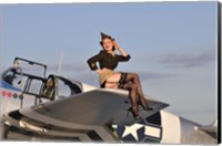 Framed Pin-up girl sitting on the wing of a P-51 Mustang