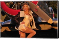 Framed 1940's pin-up girl posing with a vintage T-6 Texan aircraft