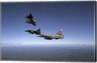 Framed Four Saab 37 Viggen fighters breaking up over northern Sweden