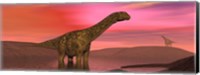 Framed Argentinosaurus dinosaurs amongst a colorful red sunset